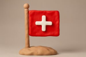Drapeau suisse sur mât. Pâte à modeler et argile.